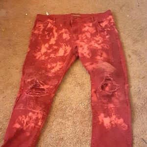 Red holey Jean's and black sweater